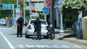 Cops pull over car in a bicycle