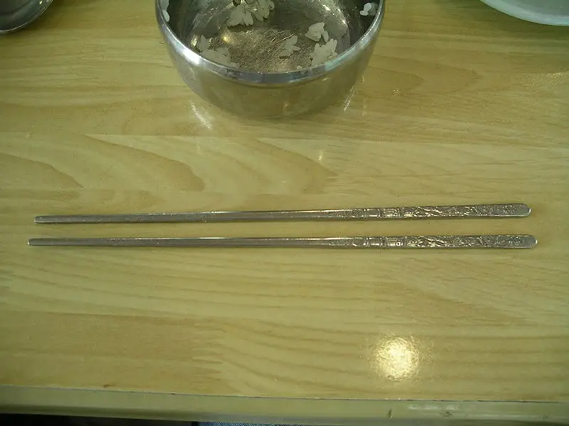 Why do Koreans use metal chopsticks?